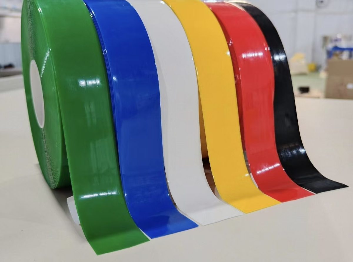 Heavy-duty PVC floor marking tape rolls lined up in green, blue, white, yellow, red and black